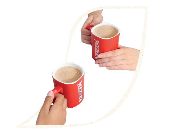 hands holding nescafe coffee mugs