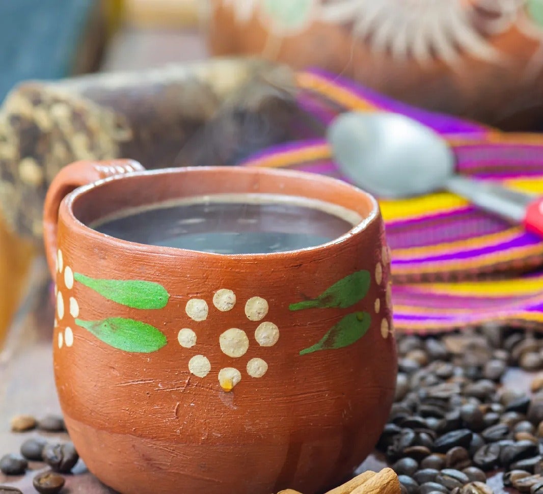 Mexican café de olla coffee in clay cup