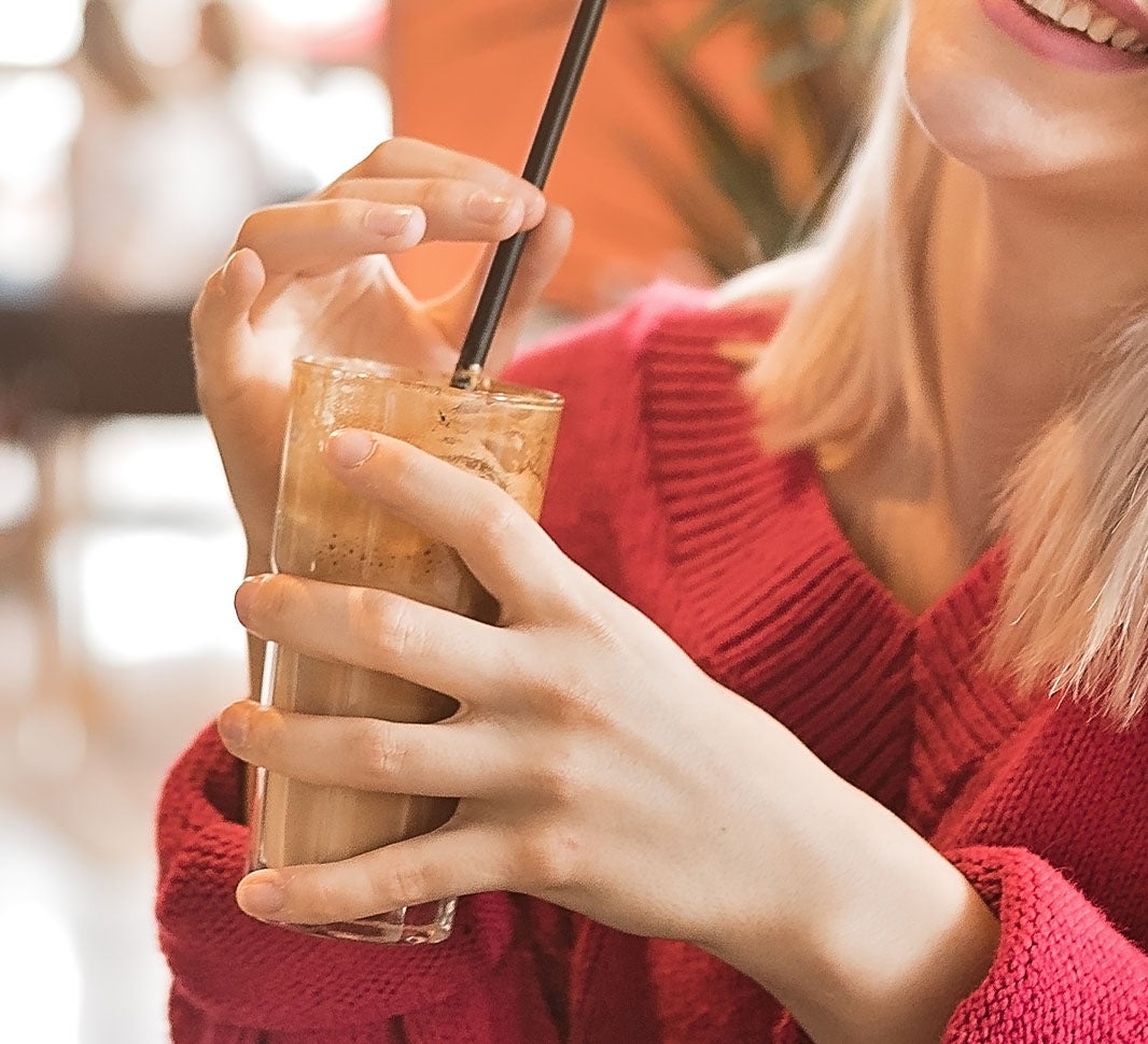 Girl enjoying iced cappuccino