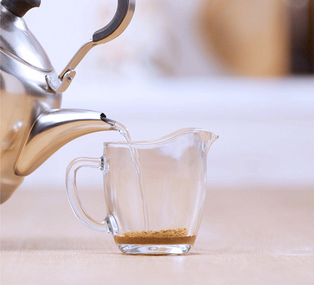 Pouring hot water into a cup