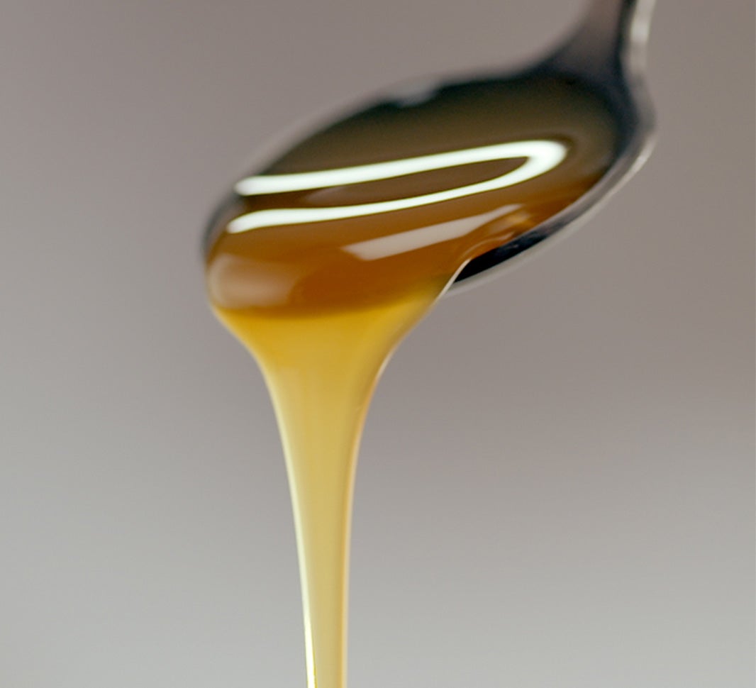 Syrup pouring off a spoon