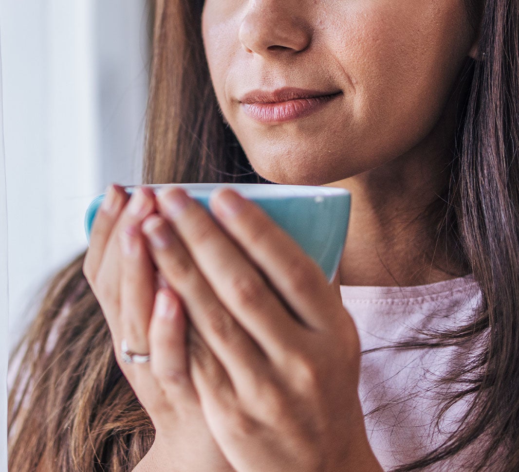 Girl holding a cup of coffee