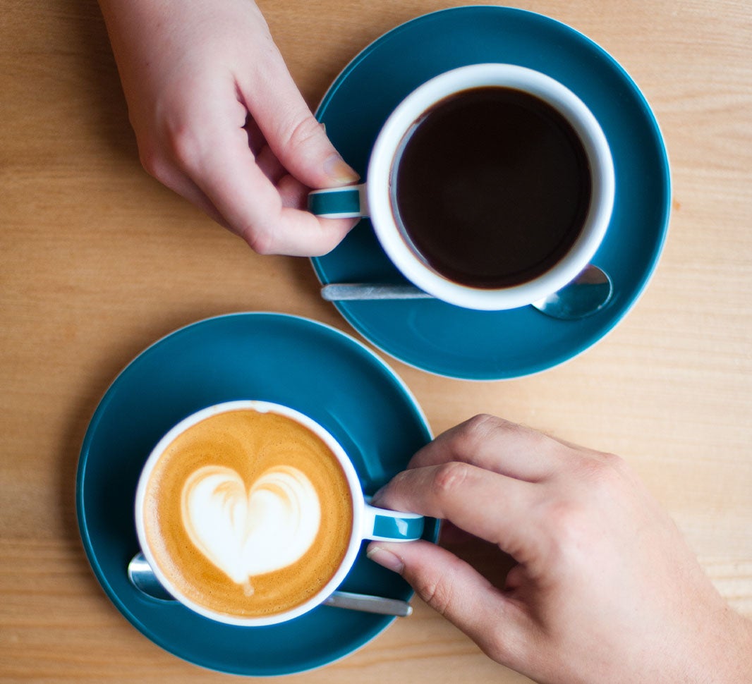 A cup of americano and a cup of flat white