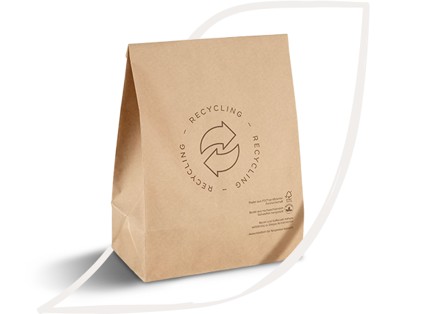 A brown paper coffee package featuring a recycling symbol and sustainability messaging