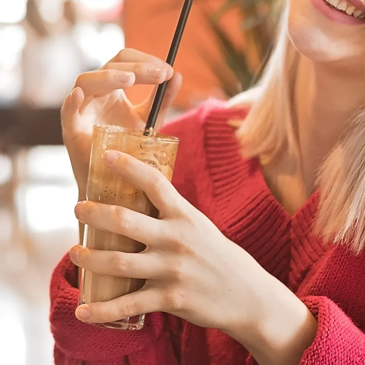 Girl enjoying iced cappuccino
