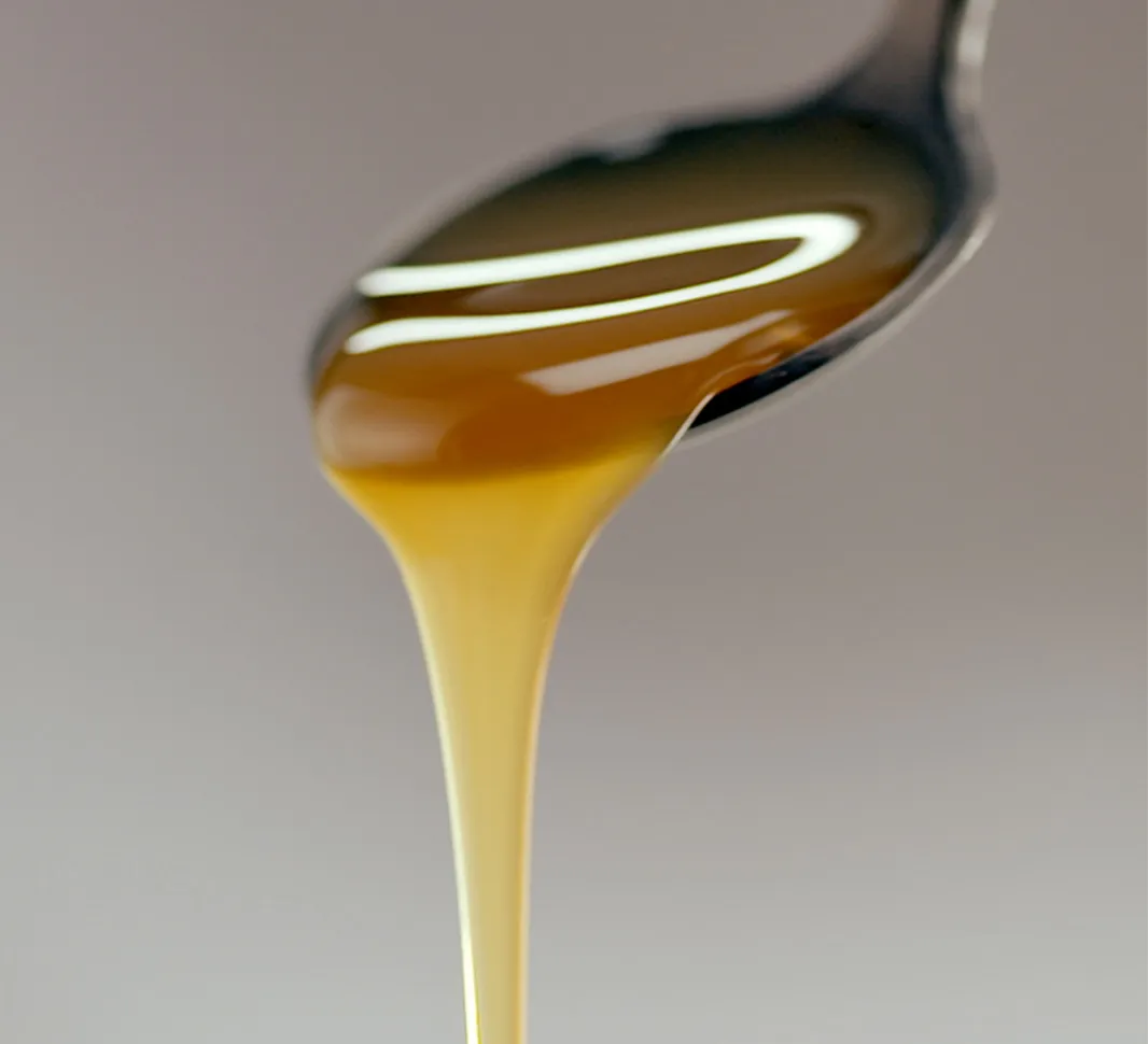 Syrup pouring off a spoon