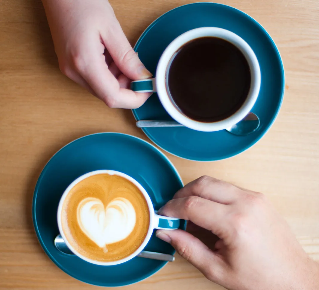 A cup of americano and a cup of flat white