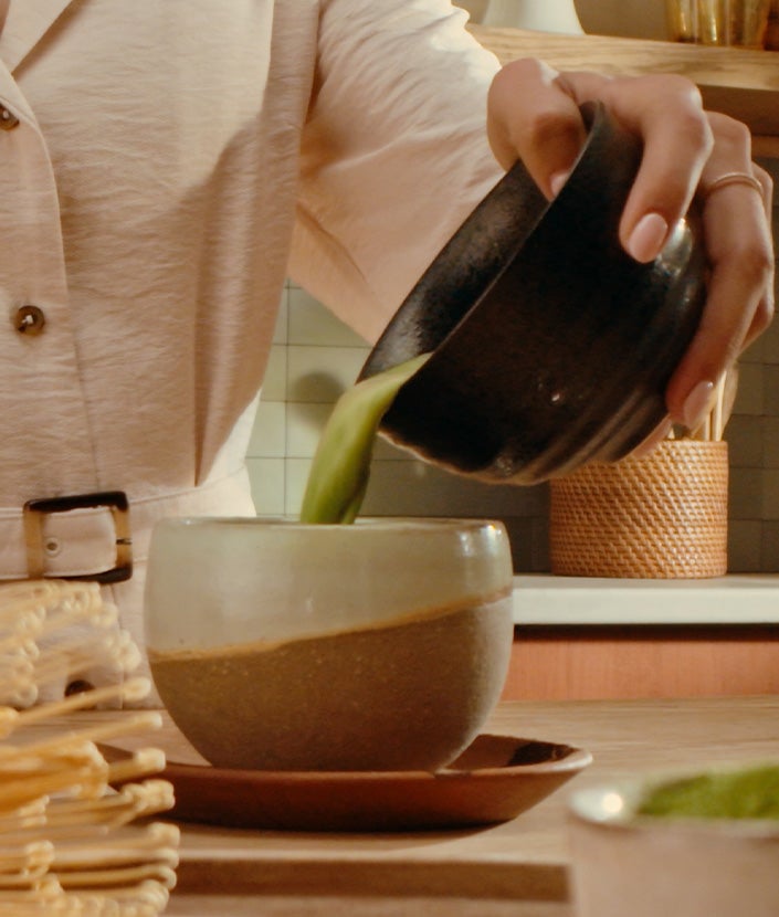 Pouring Matcha into a cup