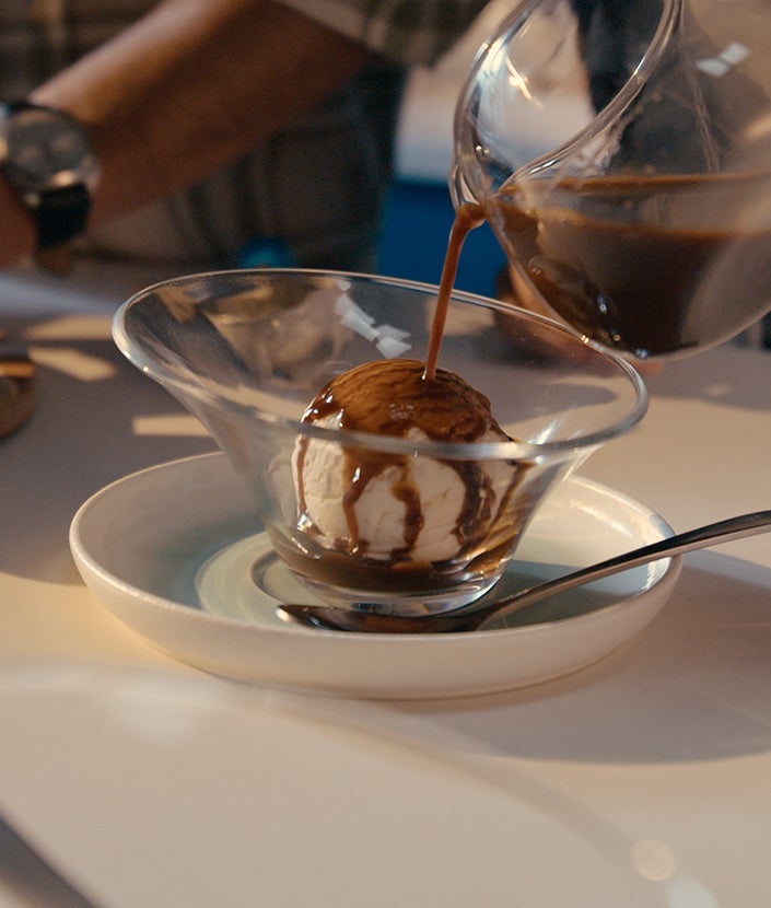 Pouring coffee over ice cream