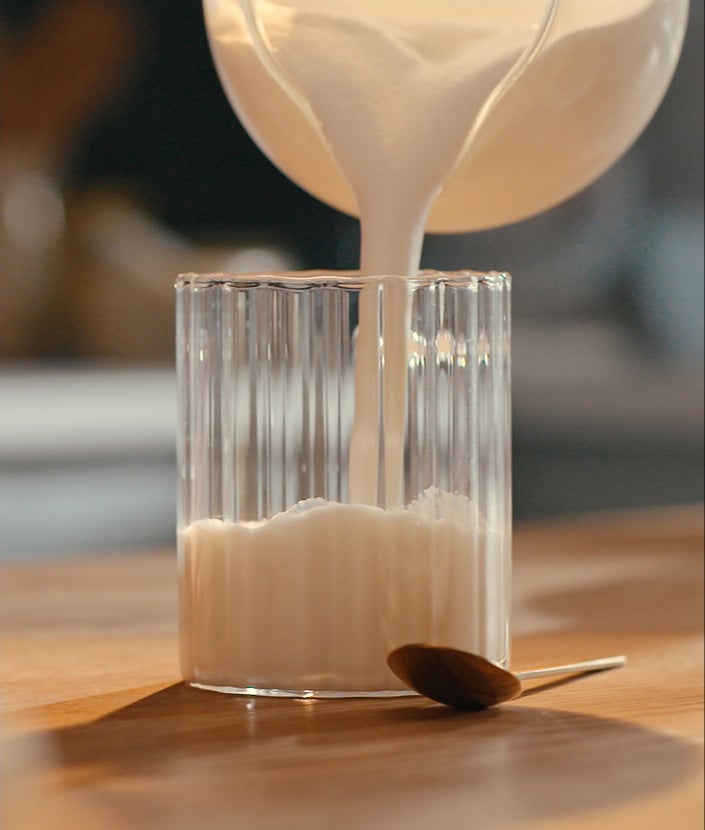 Pouring milk into mug
