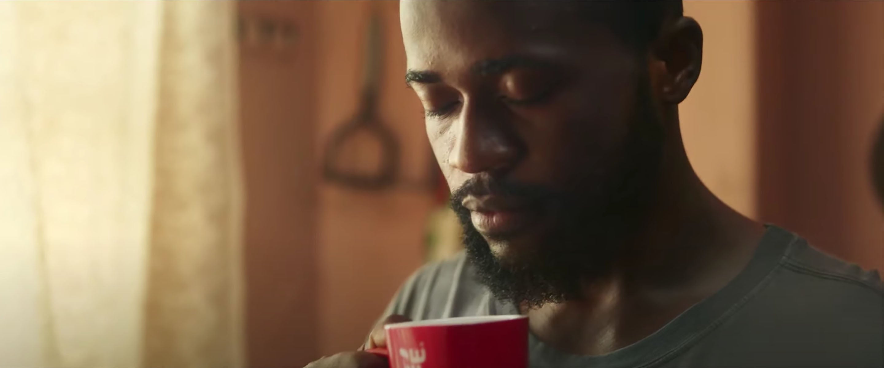 Man drinking NESCAFE coffee