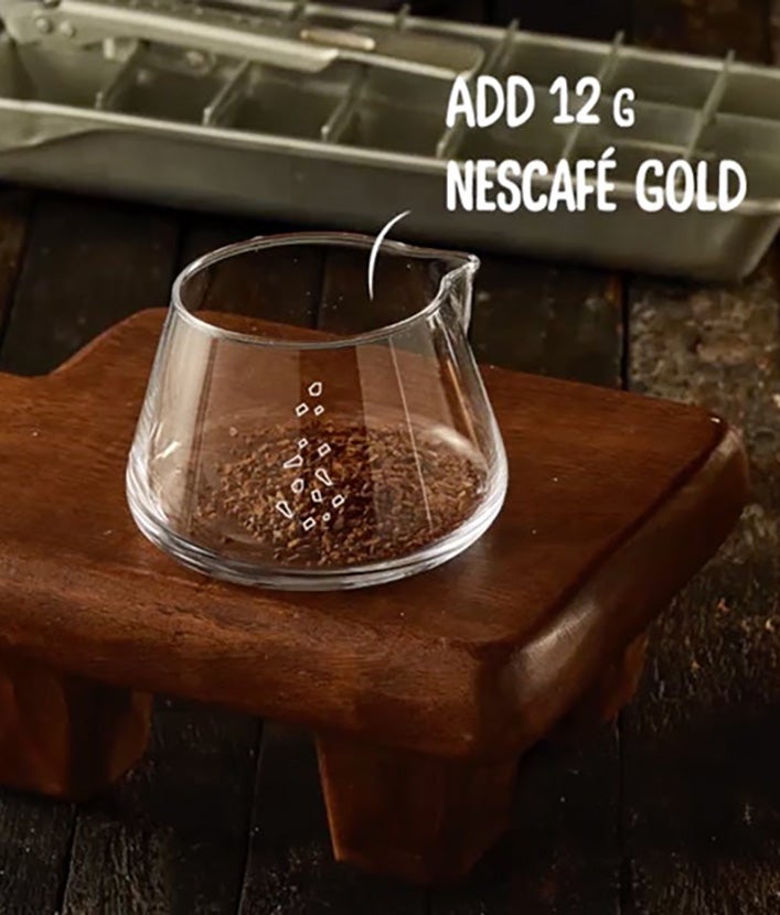 Coffee with cocoa recipe, step 1: Measuring cup with NESCAFÉ GOLD