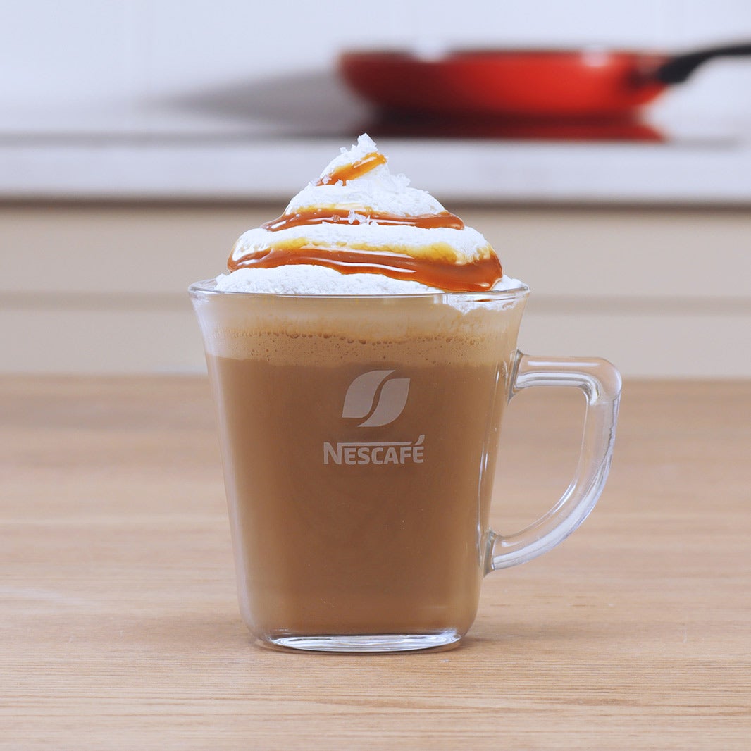 LONDON, UK - AUGUST 15, 2019: Pack of Nescafe Gold Cappuccino with coffee  beans and sugar cubes on light background Stock Photo - Alamy