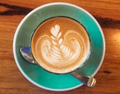 Cup of coffee art latte