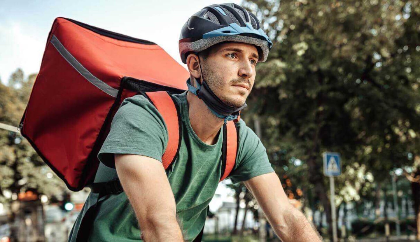 Man on a bike delivering groceries