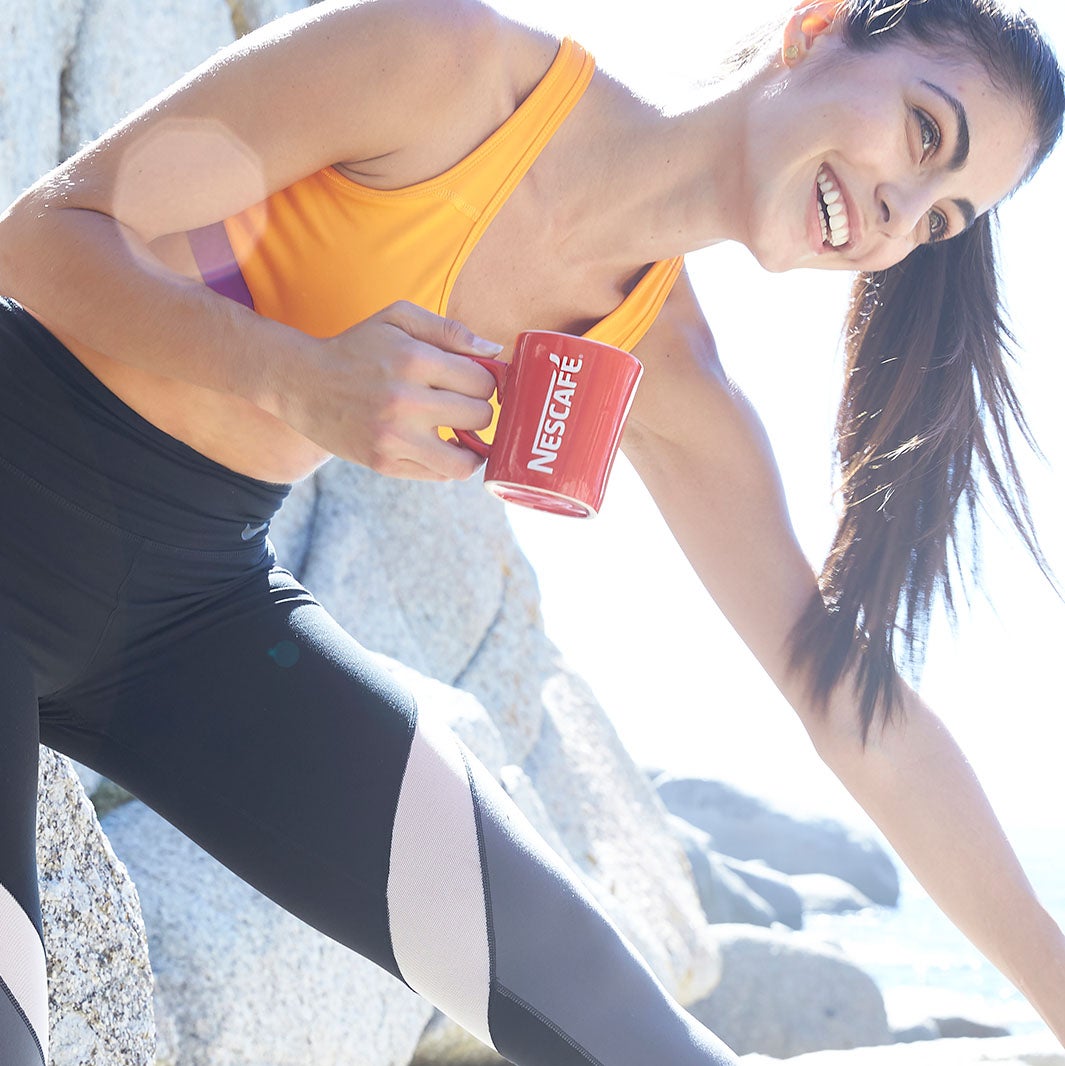 Girl with red NESCAFE cup