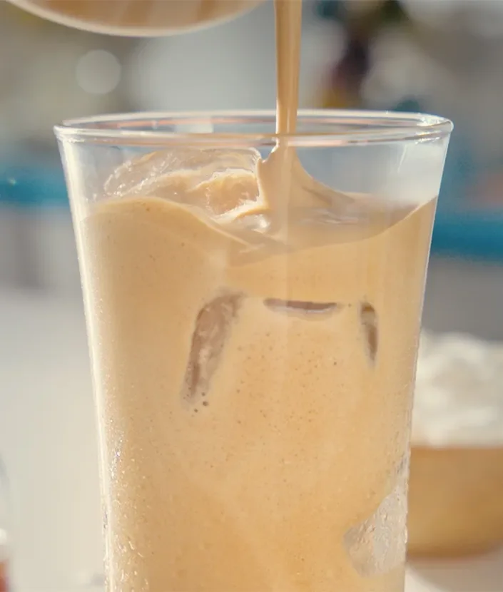 Adding coffee in the glass