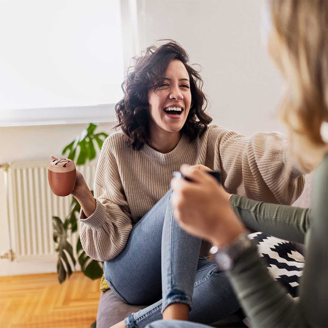 women talking and drinking coffee