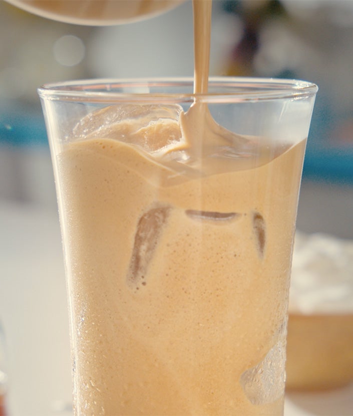 Adding coffee in the glass