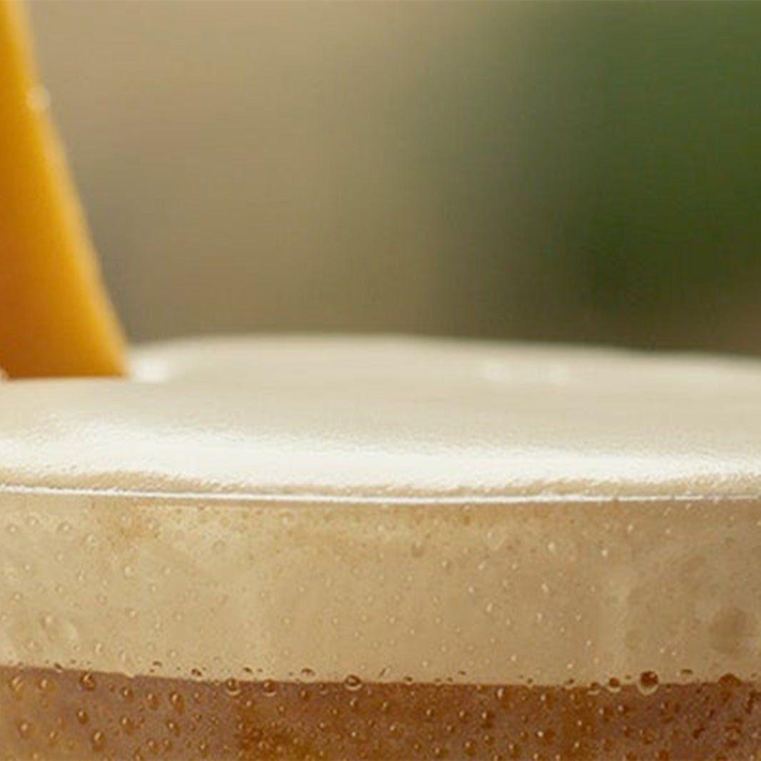 Glass som inneholder en Nescafé Mango Frappé