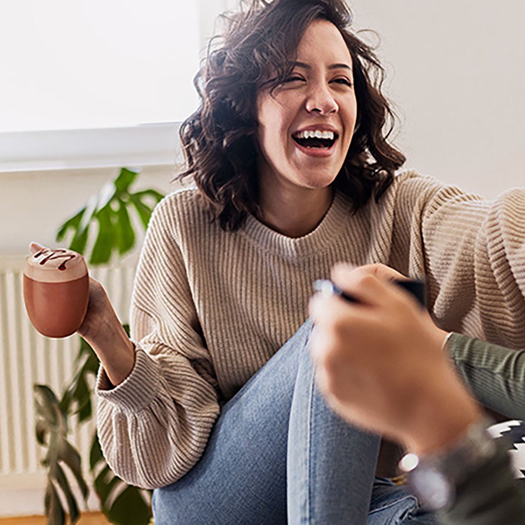 Woman holding cup of coffee