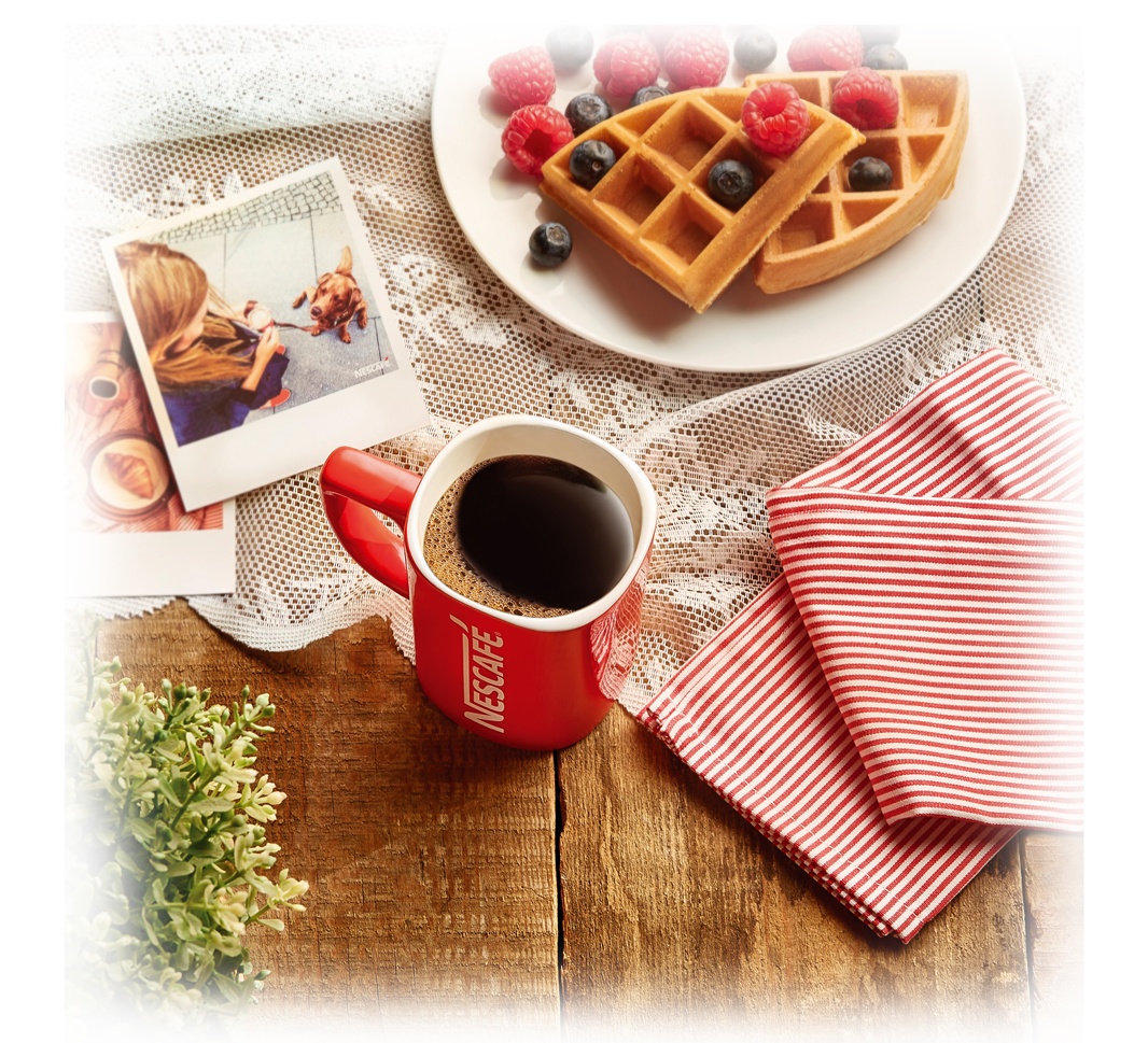 NESCAFÉ red mug on the table