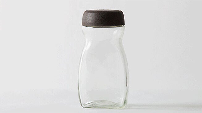 Empty glass NESCAFÉ jar 
