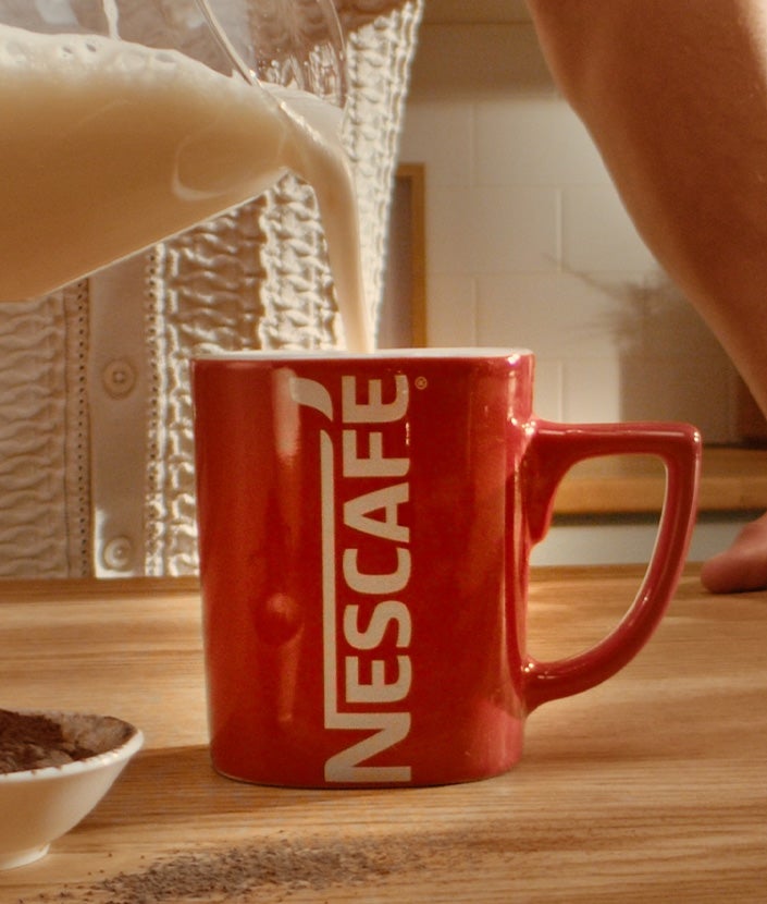 Adding milk in the cup