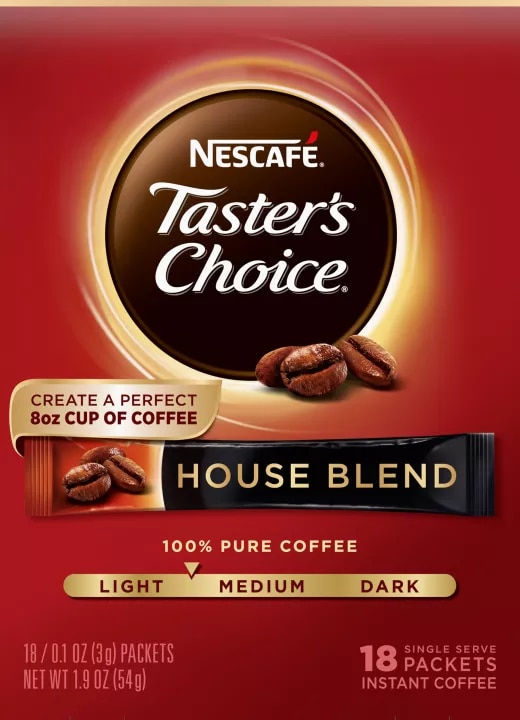 A red box of Taster’s Choice House Blend instant packets with coffee beans near the Taster's Choice logo.