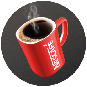 A red Nescafé mug filled with coffee on a dark brown circle.