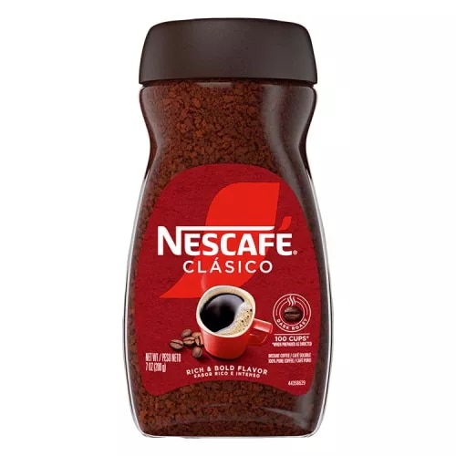 A jar of Nescafé Clásico Dark Roast with a black cap, brown label and red coffee mug.