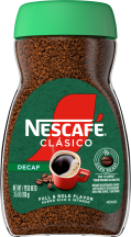 A jar of decaf Nescafé Clásico Dark Roast with a green cap, green "decaf" label and red coffee mug.