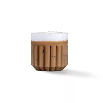 Photograph: small ribbed brown ceramic cup with white foam, shadow on white background