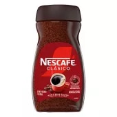 Un frasco de NESCAFÉ Clásico Dark Roast con una tapa negra, etiqueta marrón y una taza de café roja.