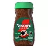 Un frasco de café descafeinado NESCAFÉ Clásico Dark Roast con una tapa verde, etiqueta verde de "descafeinado" y una taza de café roja.